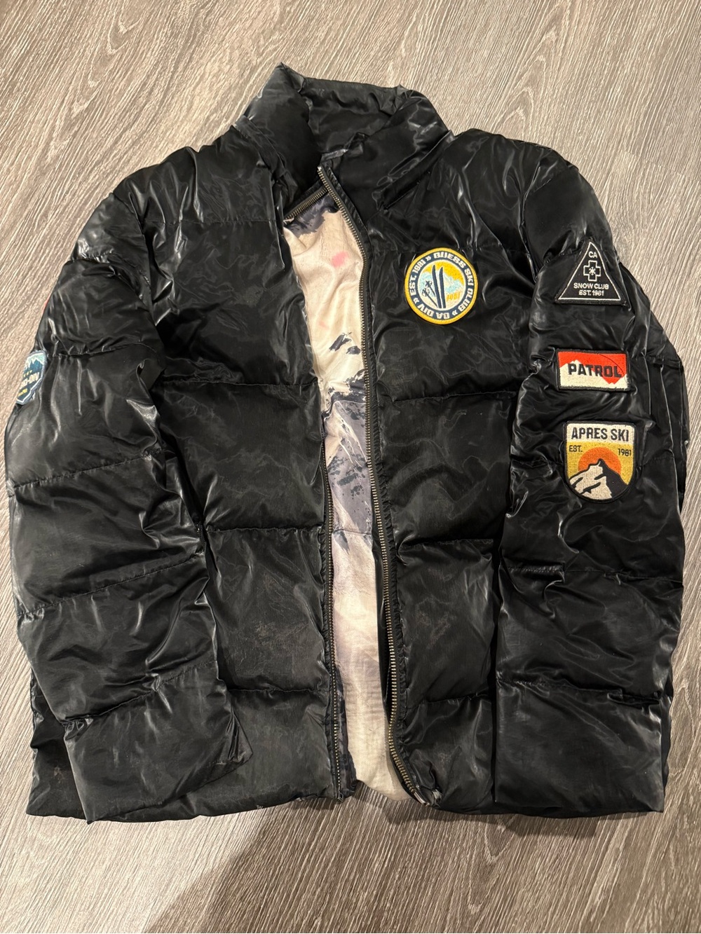 Black Puffer Jacket with Ski Patch Details